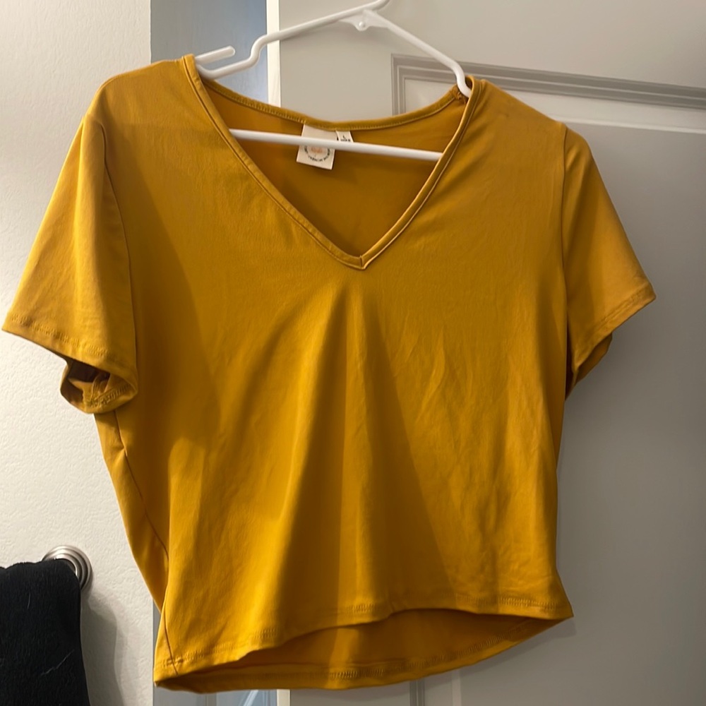 Large mustard yellow soft cropped v-neck. Never worn